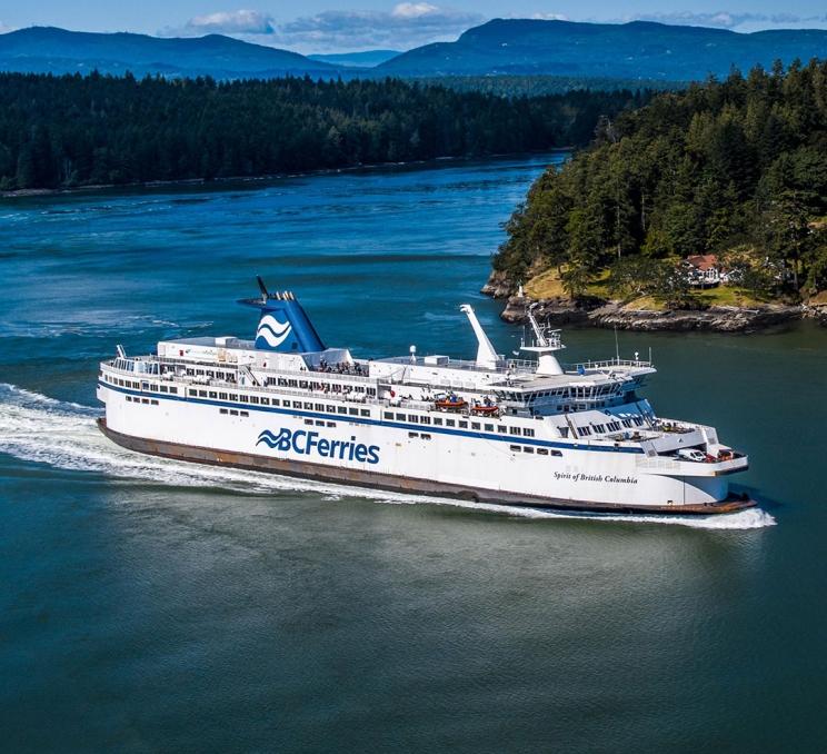 A BC Ferries vessel sails between the Southern Gulf Islands on route to Victoria, BC