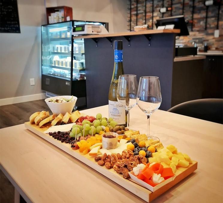 A cheese board and wine at L'Apero Wine & Cheese Bistro in Victoria, BC