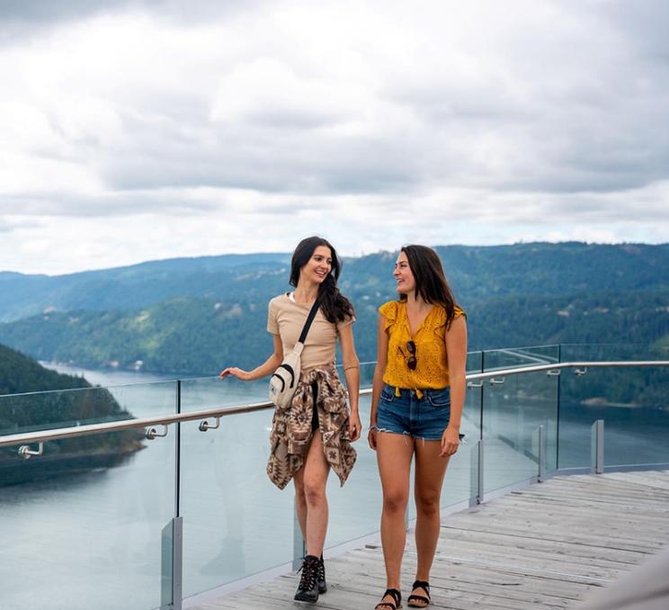 A couple walks along the observation deck of the Malahat SkyWalk in Victoria, BC