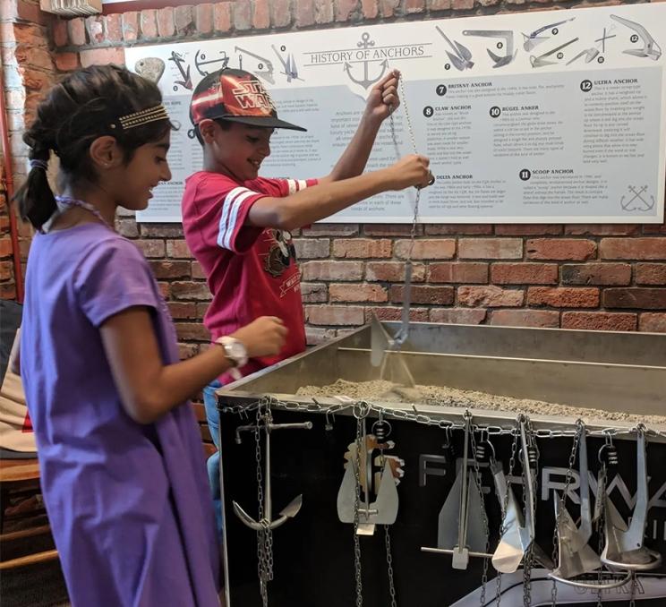 Two children play a game at the Maritime Museum of BC in Victoria, BC