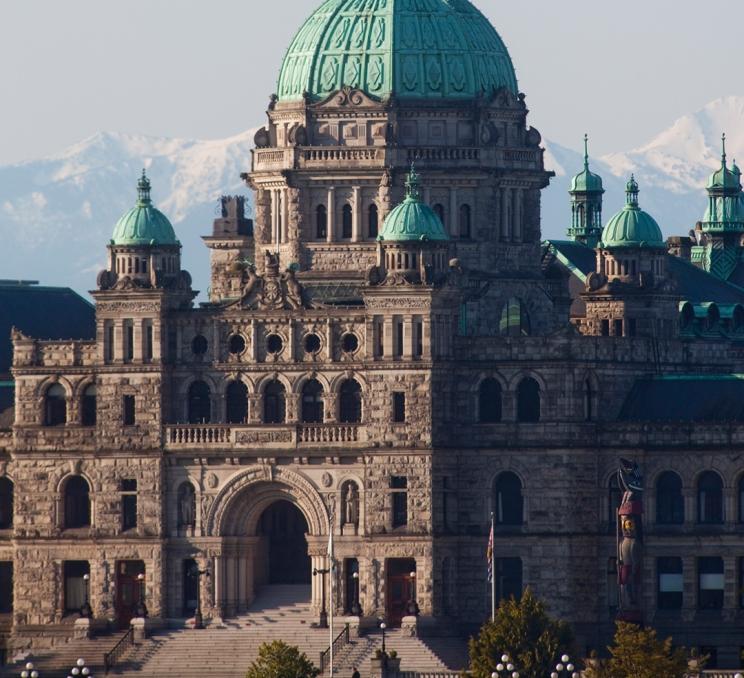 The BC Parliament Buildings back dropped by the Olympic Mountains, Victoria, BC