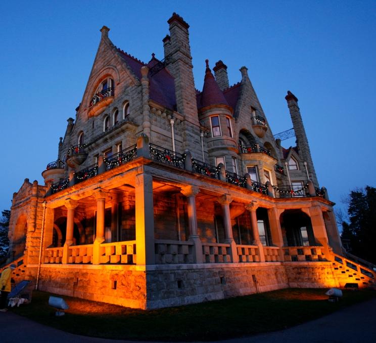 Craigdarroch Castle illuminated at sunset in Victoria, BC