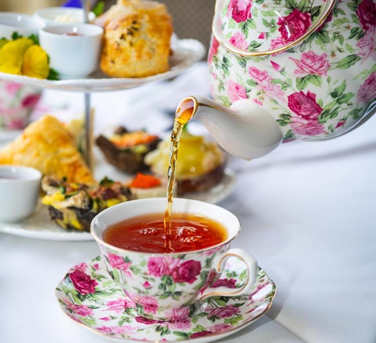 A cup of tea is poured during Afternoon Tea at the Pendray Inn and Teahouse in Victoria, BC