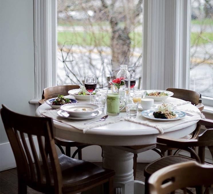 A window table set for brunch at Nourish Kitchen and Cafe in Victoria, BC