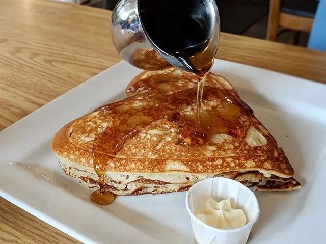 Heart shaped pancakes drizzled with syrup at Floyd's Diner in Victoria, BC