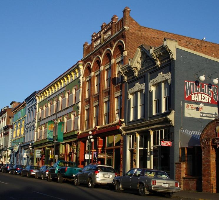 Historic buildings line Lower Johnson Street in Victoria, BC