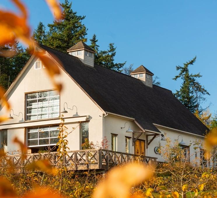 The exterior of Sea Cider Farm & Ciderhouse on a fall day in Victoria, BC