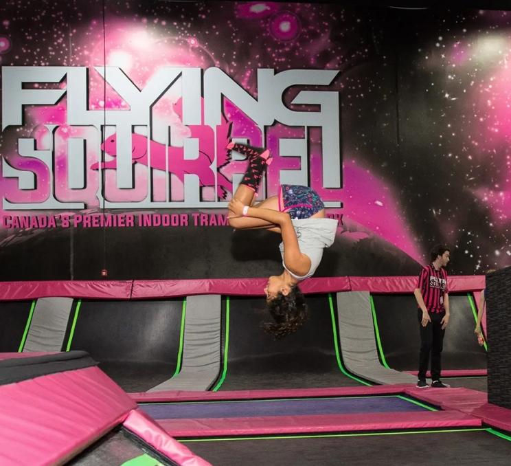 A child flips through the air at Flying Squirrel Victoria in Victoria, BC