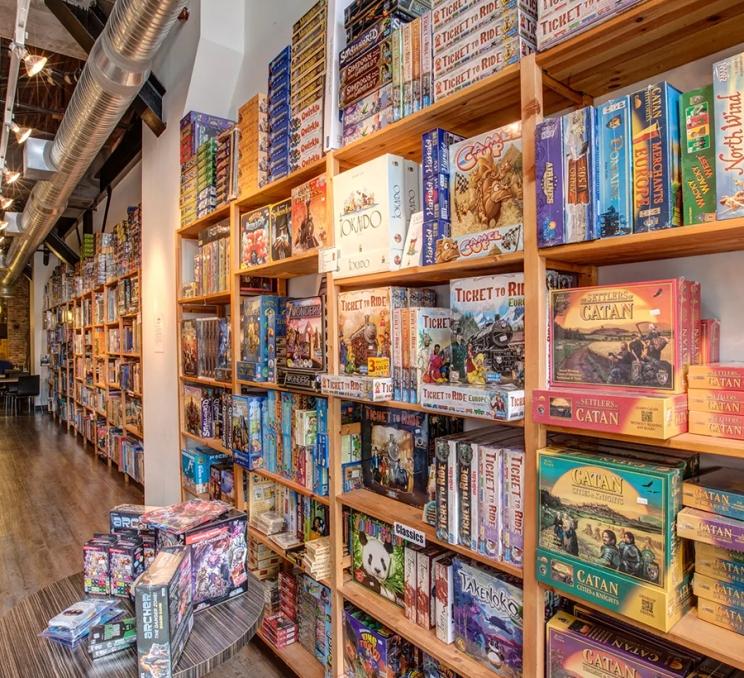 A wall of board games at Interactivity Board Game Cafe in Victoria, BC