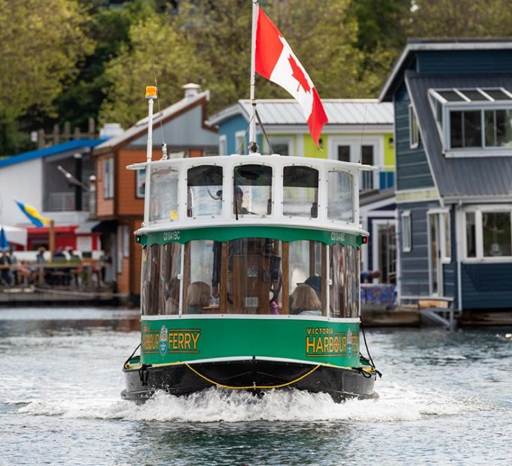 A Victoria Harbour Ferry leaves Fisherman's Wharf in Victoria, BC