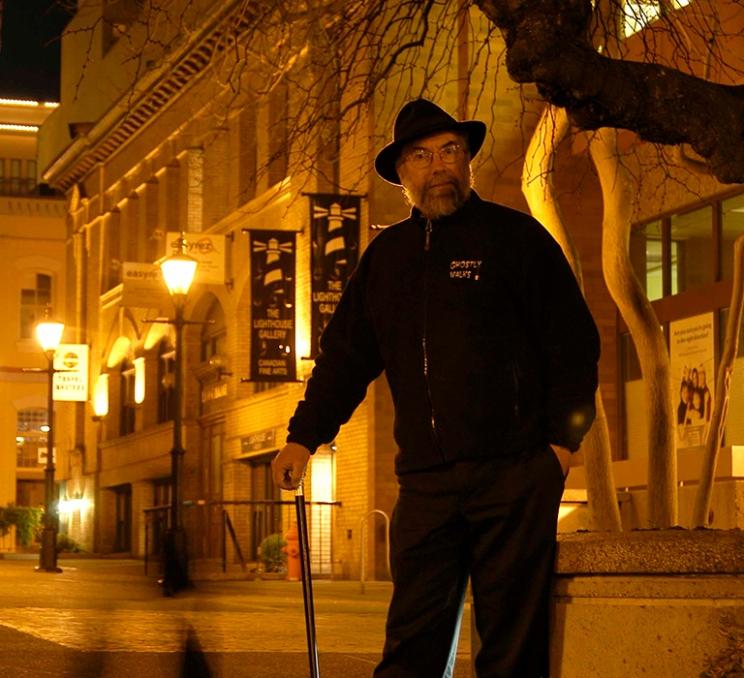 A Ghostly Walks guide in Bastion Square in Victoria, BC