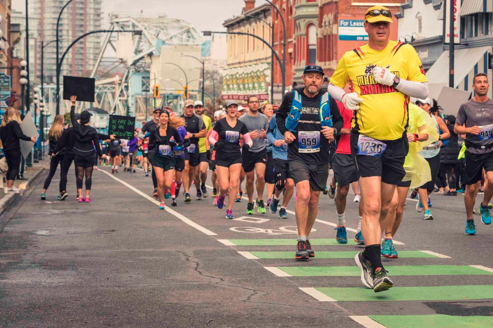 Marathon participants running through downtown Victoria