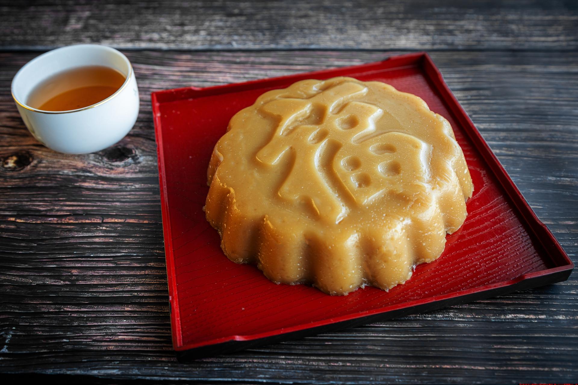 A traditional nian gao or "new year cake", served with tea