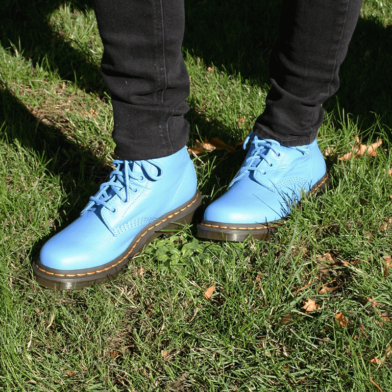 Blue Doc Martin's from Baggins Shoes on green grass