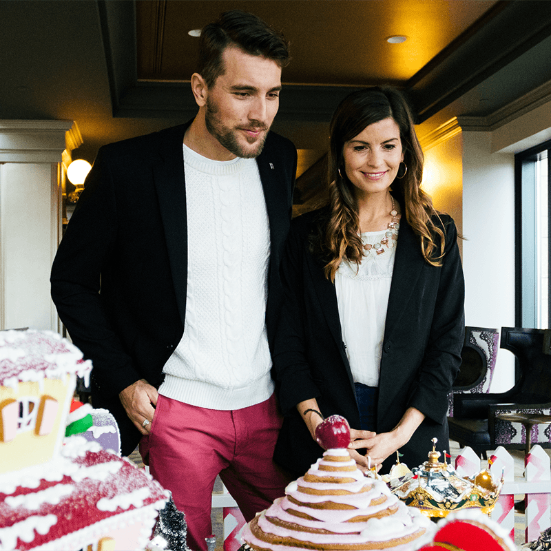 Couple Looking at the Creations at the Gingerbread Showcase