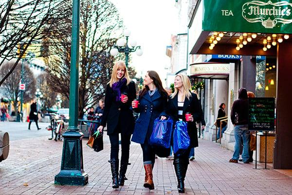 Women walking on Government Street past Murchie's