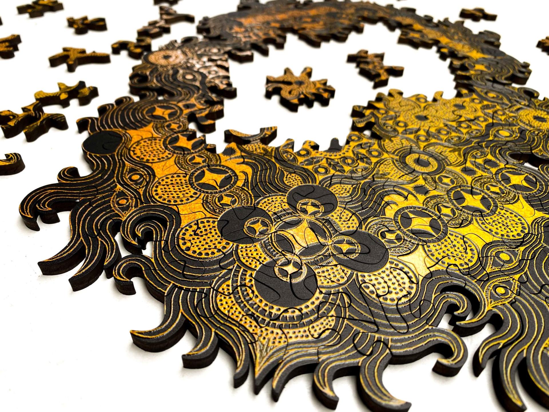 A deconstructed golden mandala puzzle from Puzzle Lab