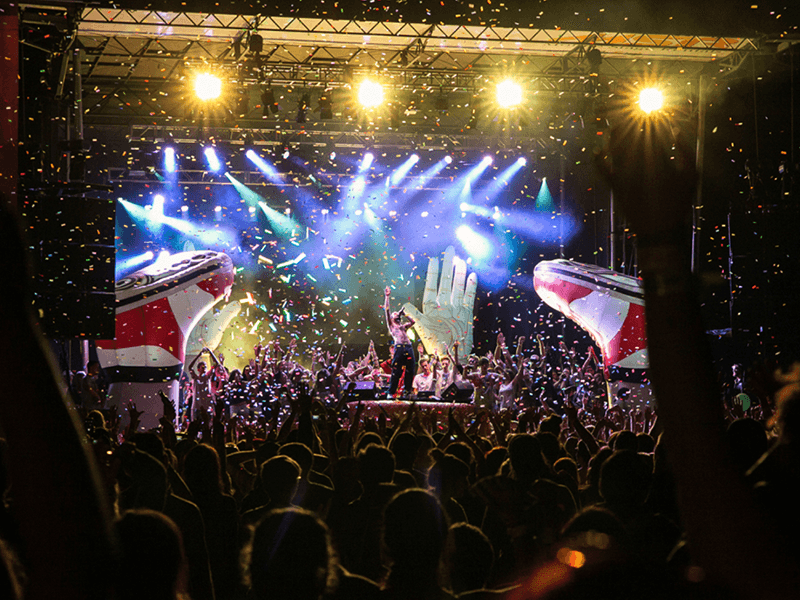 A performer celebrates to a confetti finale at Rifflandia