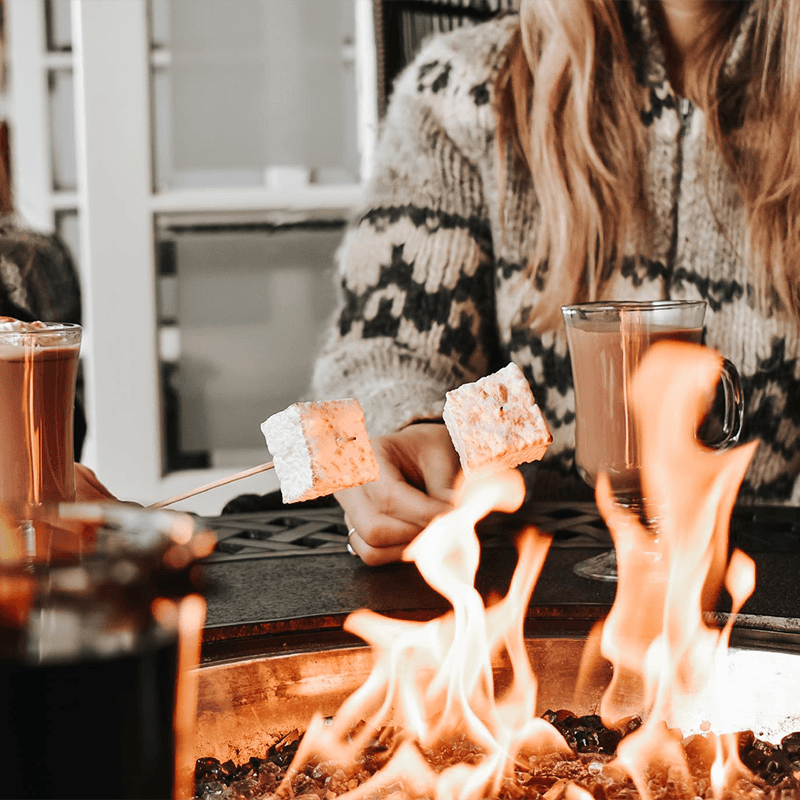 Roasting marshmallows for s'mores atop the Veranda at the Fairmont Empress hotel