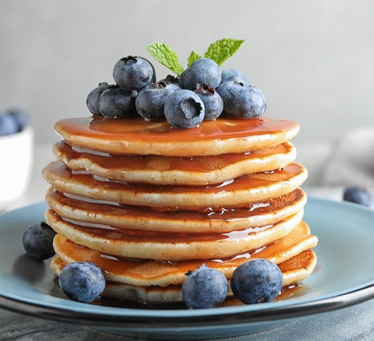 A stack of blueberry pancakes