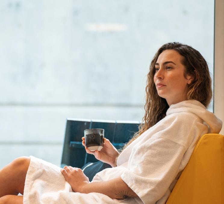 A woman unwinds at RITUAL Nordic Spa in Victoria, BC