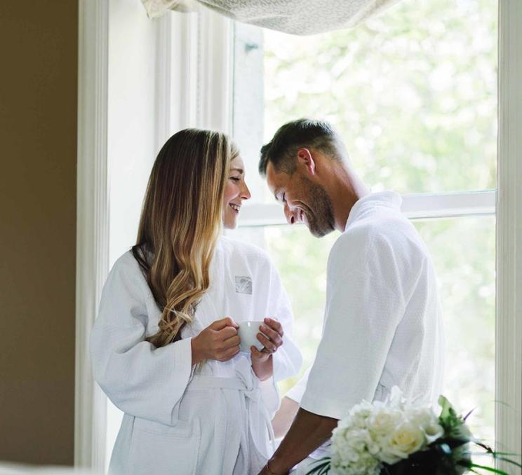 A couple has a laugh at Willow Stream Spa at the Fairmont Empress in Victoria, BC