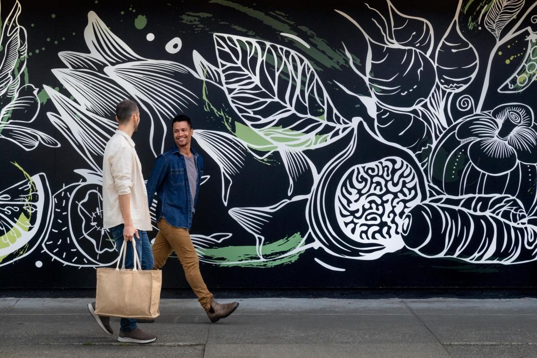 a young couple shopping in cook street village