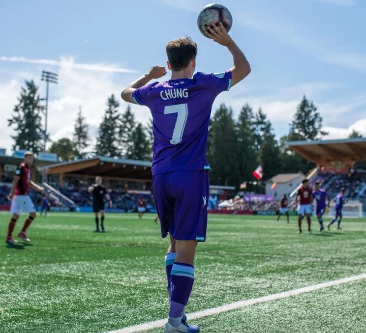 A throw in during a soccer match with Pacific FC in Victoria, BC