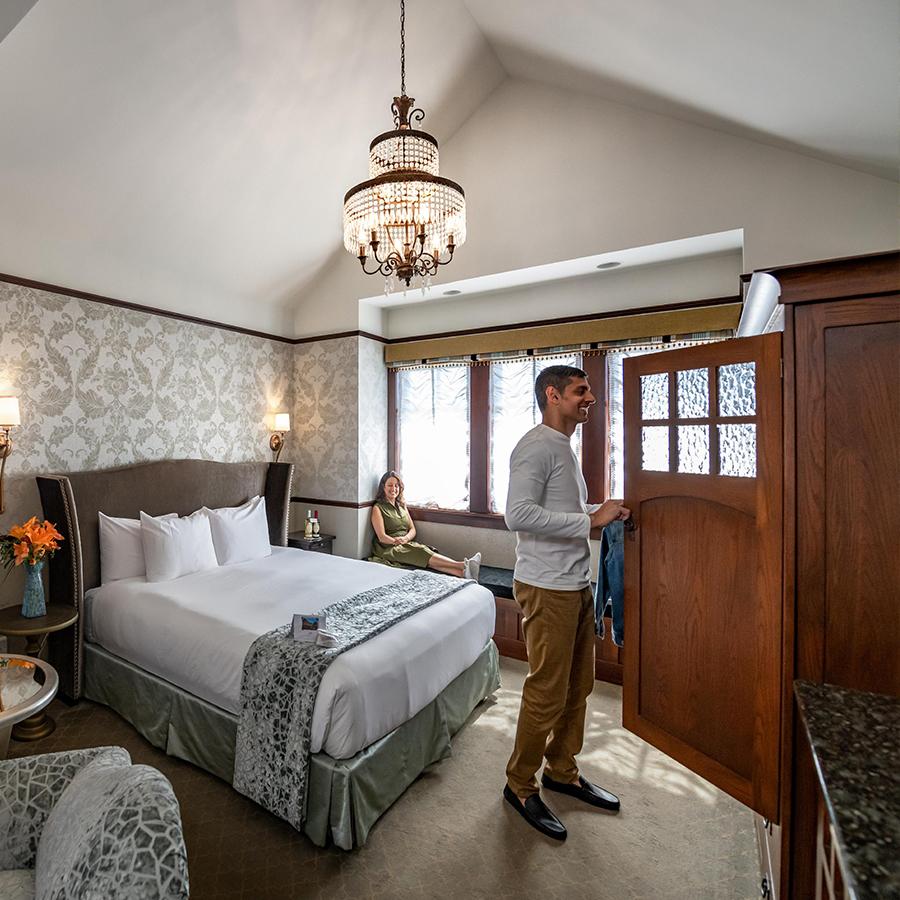 A couple explores their room at Abigail's Hotel in Victoria, BC