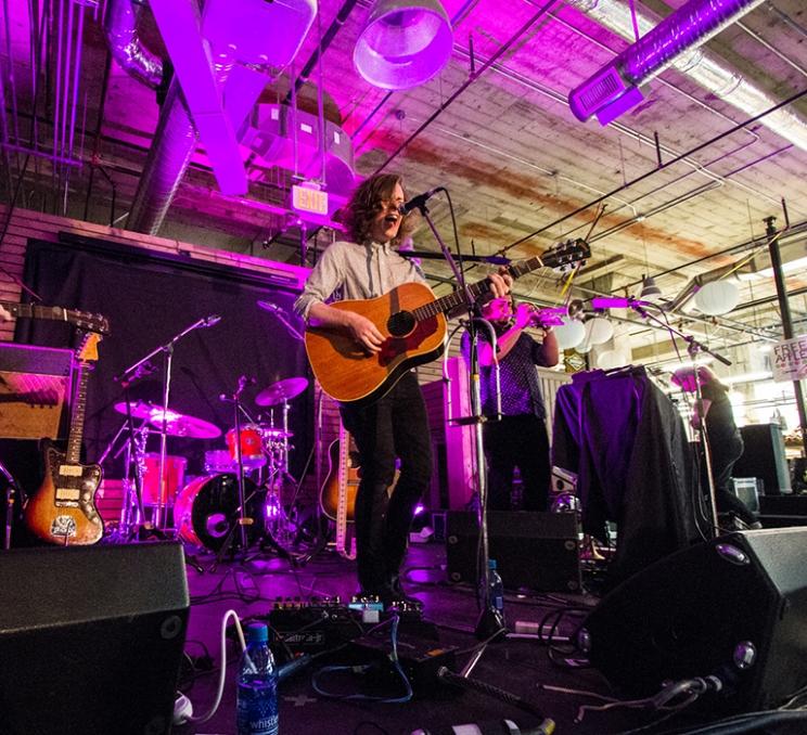 A guitar player performs at a concert in Victoria, BC