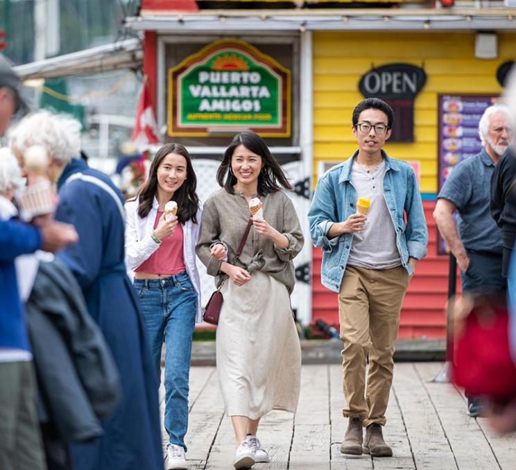 A family enjoys ice cream at Fisherman's Wharf in Victoria, BC