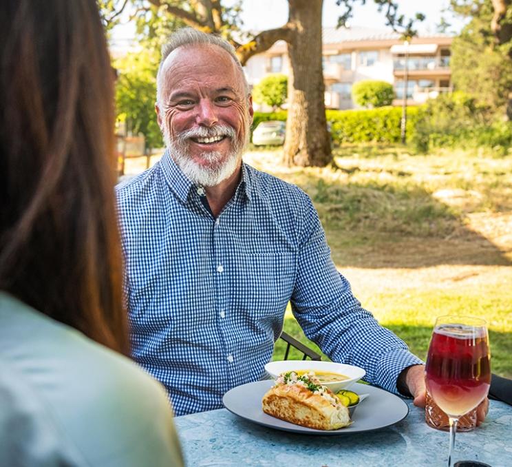 A couple dines on Fireside Grill's famed patio in Victoria, BC