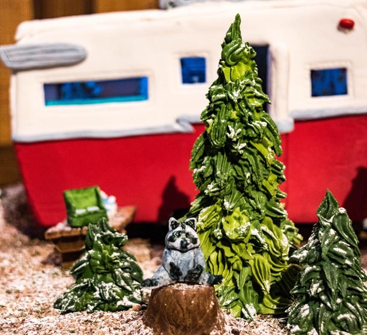 A racoon and camping themed gingerbread house at the Gingerbread Showcase in Victoria, BC