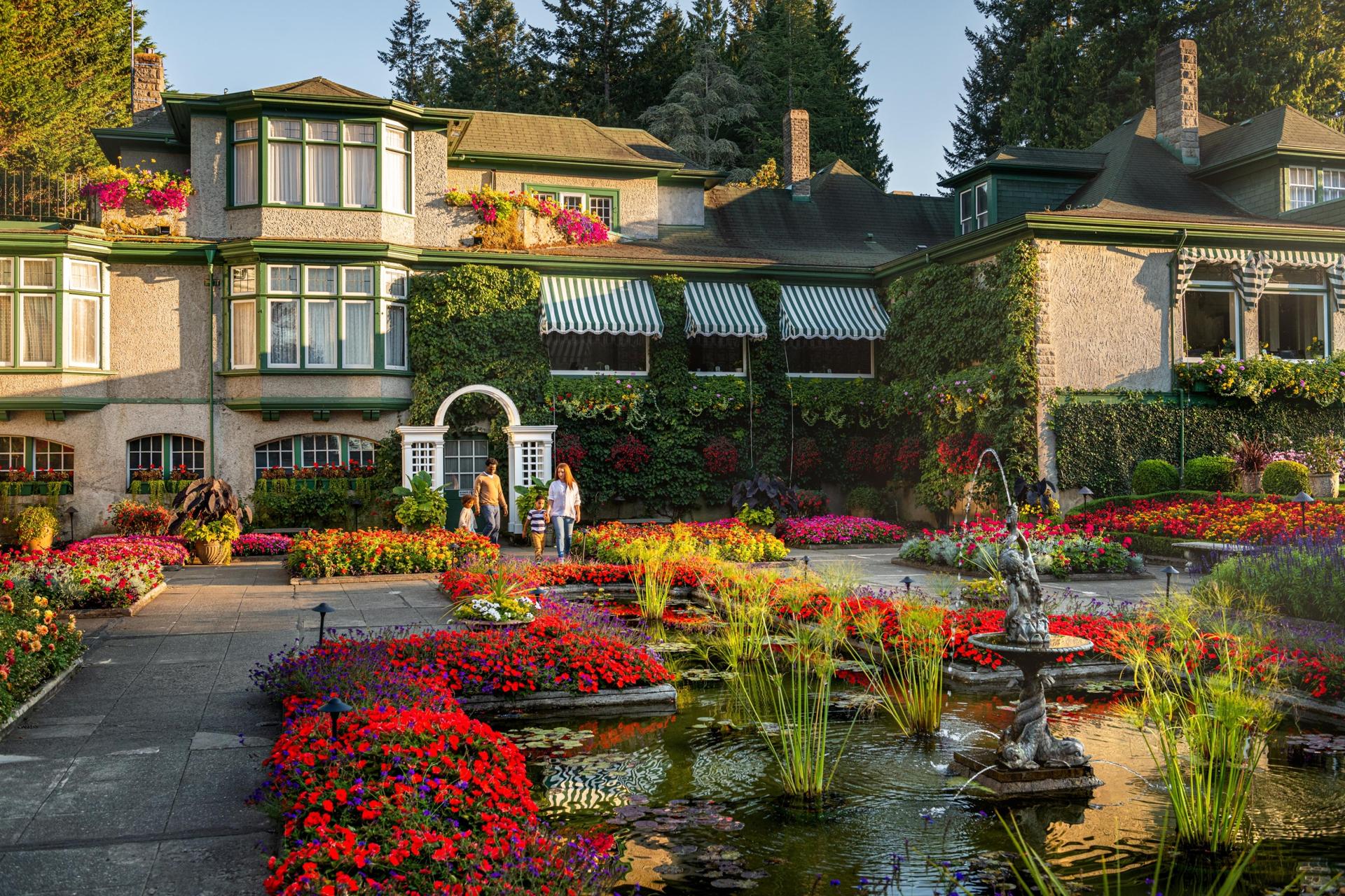 A family explores the grounds at The Butchart Gardens in Victoria, BC