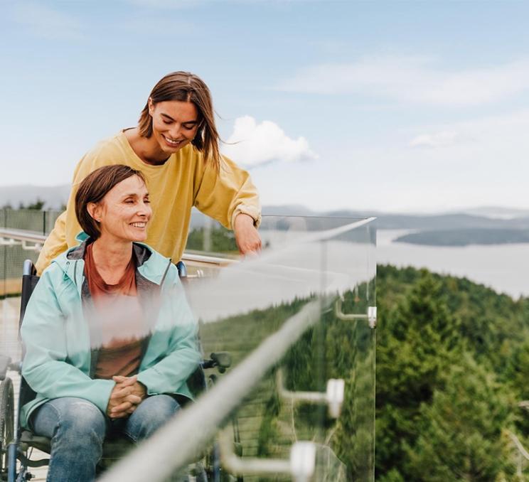 A mother and daughter take in the views atop the Malahat SkyWalk in Victoria, BC