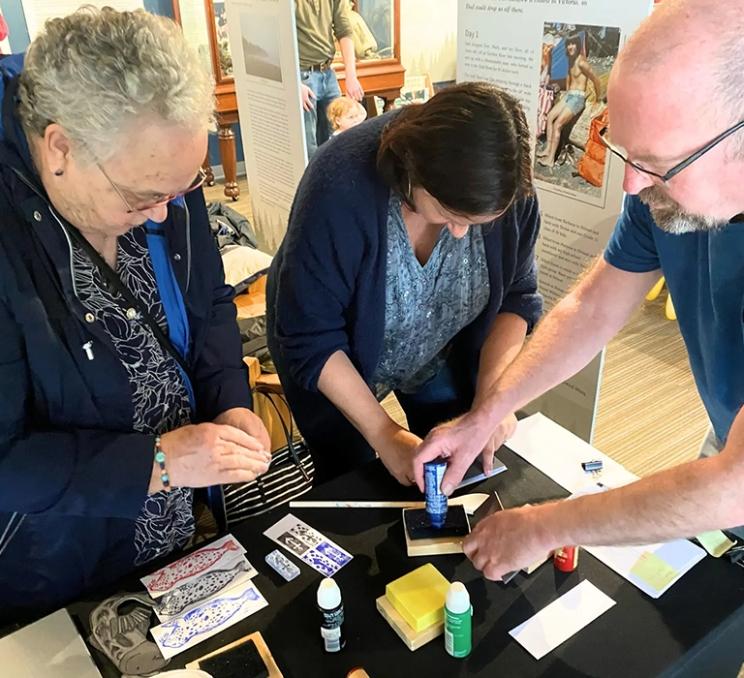 A group participates in crafts at Salty Sunday at the Maritime Museum of BC in Victoria, BC