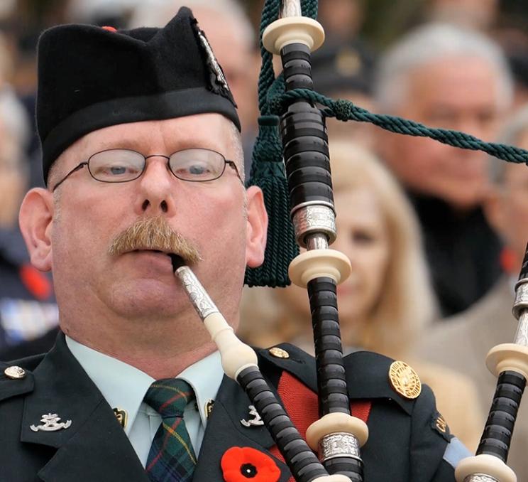 A bagpiper performs in Victoria, BC