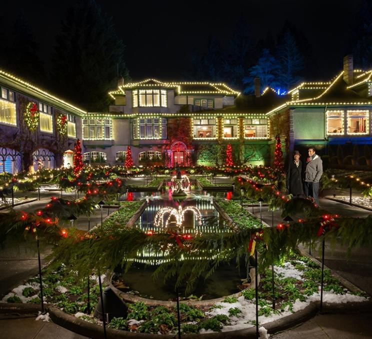 A couple enjoys the holiday lights at The Butchart Gardens in Victoria, BC