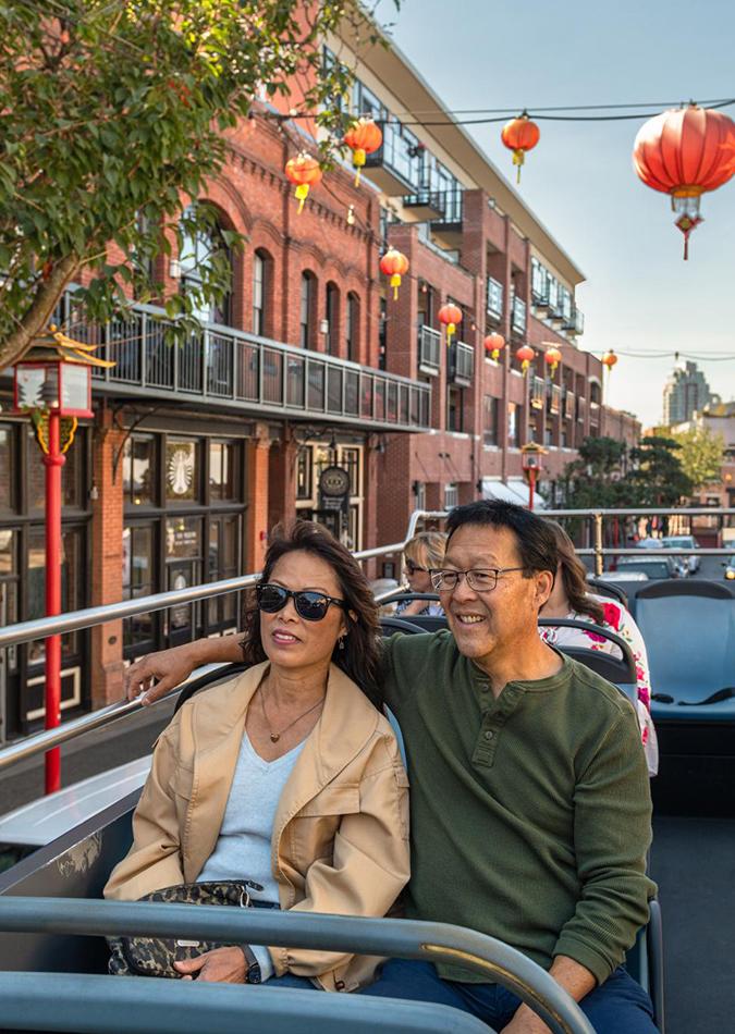 A couple enjoys a guided tour in Victoria, BC