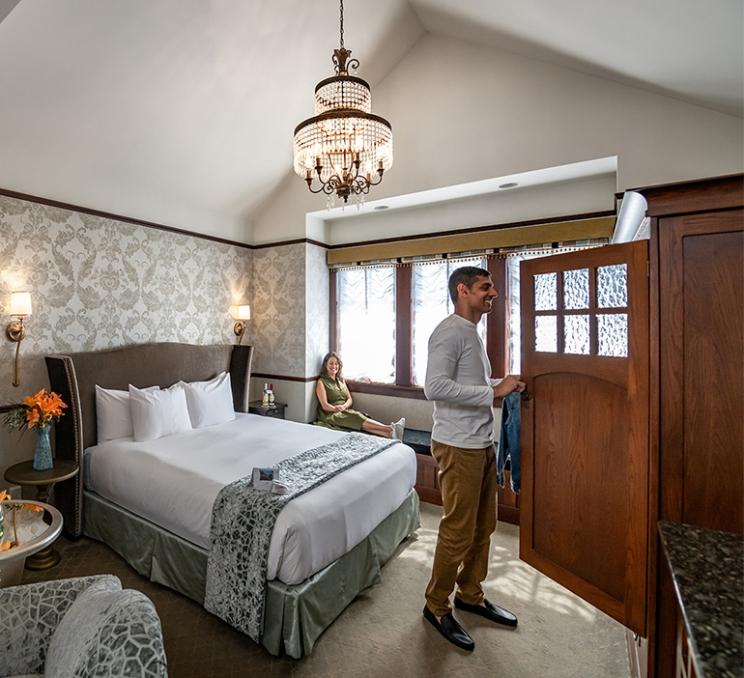 A couple settles into their room at Abigail's Hotel in Victoria, BC