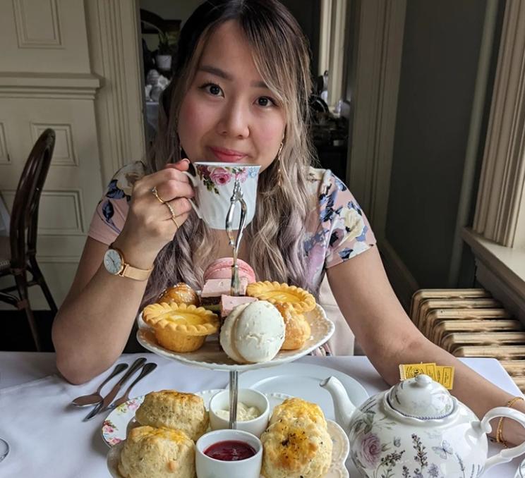 A woman enjoys afternoon tea in Victoria, BC