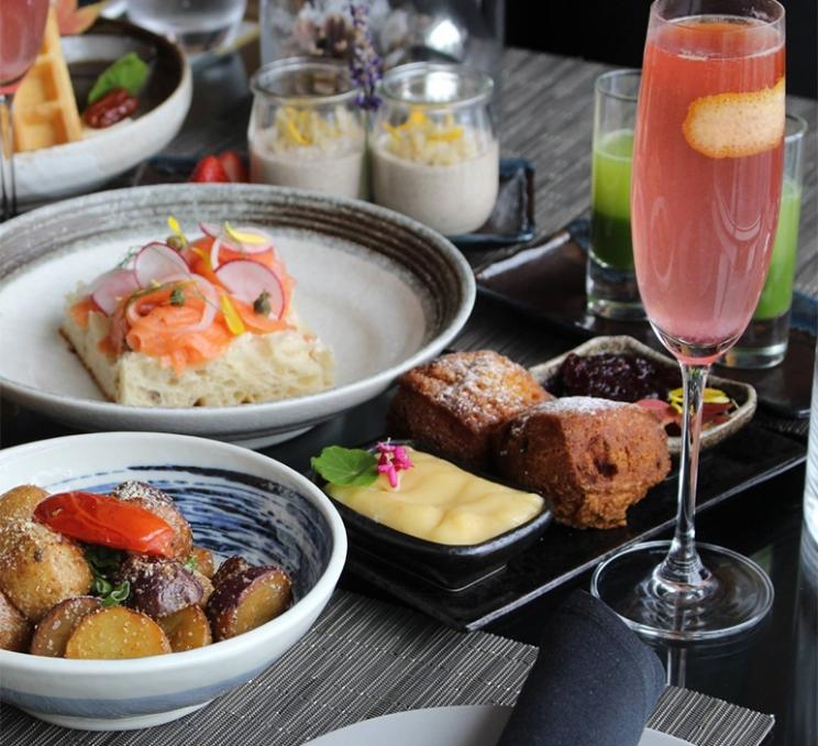 A spread of food at Aura Waterfront Restaurant + Patio in Victoria, BC