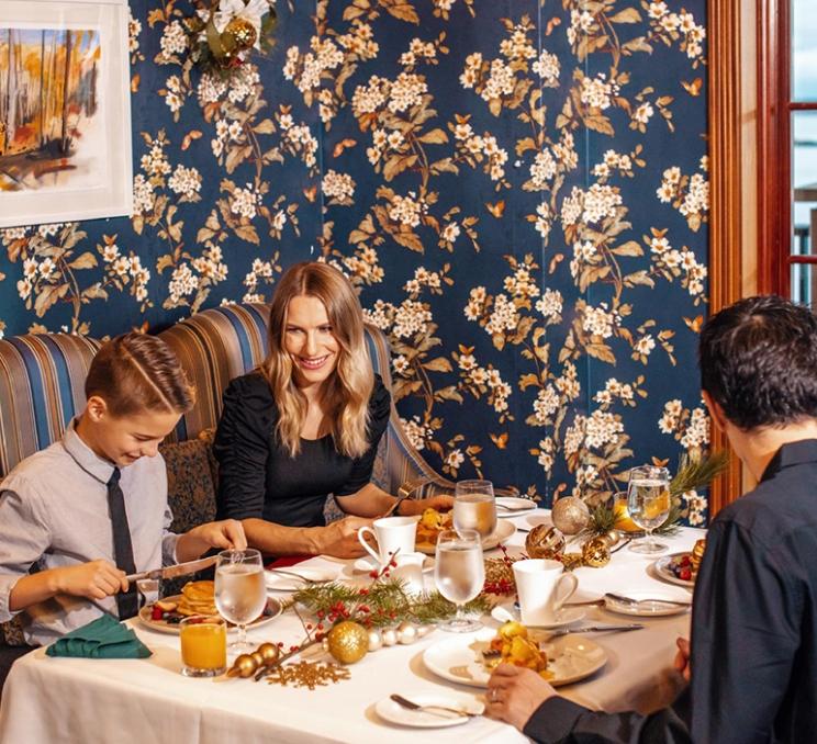 A family enjoys Christmas brunch at the Oak Bay Beach Hotel in Victoria, BC