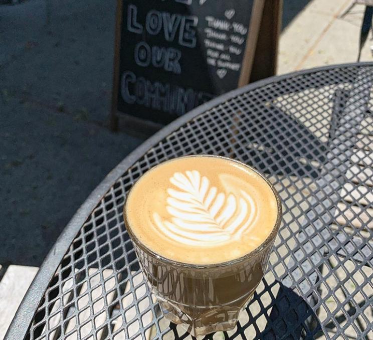 A latte on a patio at Caffe Fantastico in Victoria, BC