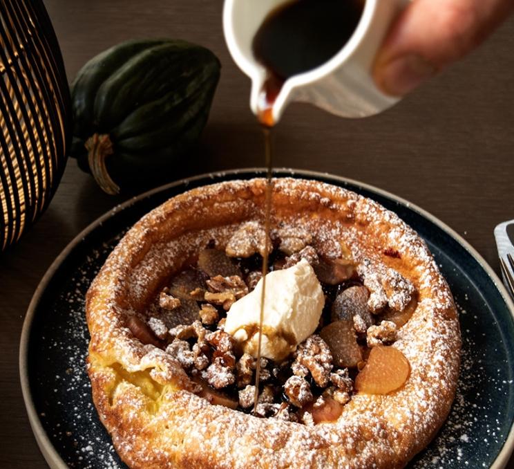 Syrup poured over a pastry at brunch at the Courtney Room in Victoria, BC