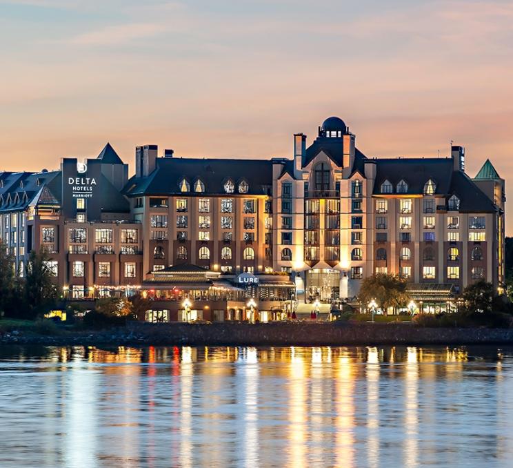 The Delta Hotels by Marriott Victoria Ocean Pointe Resort as seen from the Inner Harbour in Victoria, BC