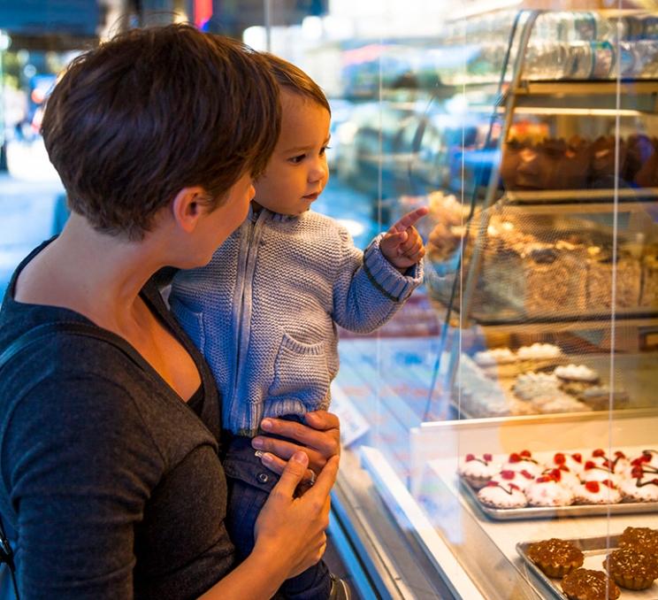 A mother and child shop for sweets at the Dutch Bakery & Diner in Victoria, BC