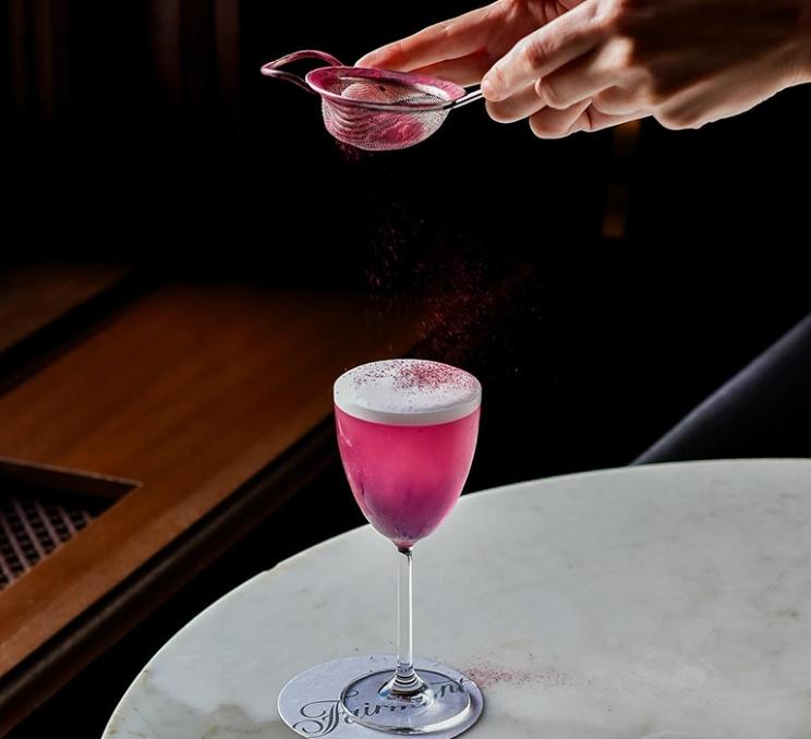 A pink cocktail at Q at the Empress at the Fairmont Empress in Victoria, BC