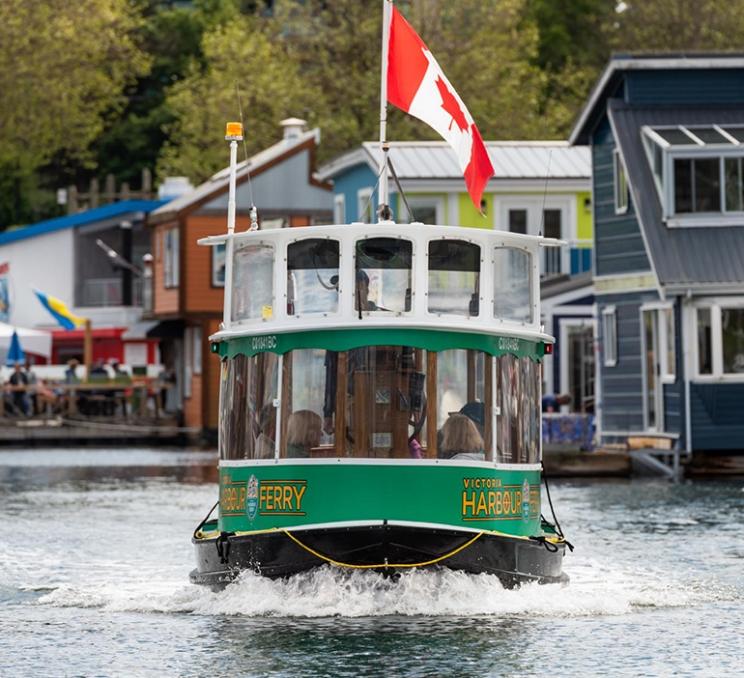 A Harbour Ferry travels across the Inner Harbour in Victoria, BC