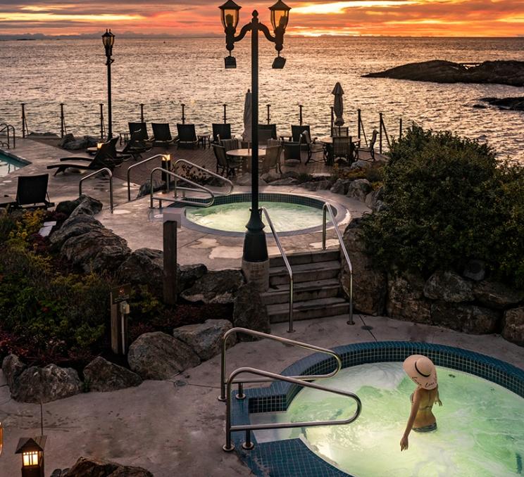 A woman soaks in the mineral pools at the Oak Bay Beach Hotel in Victoria, BC